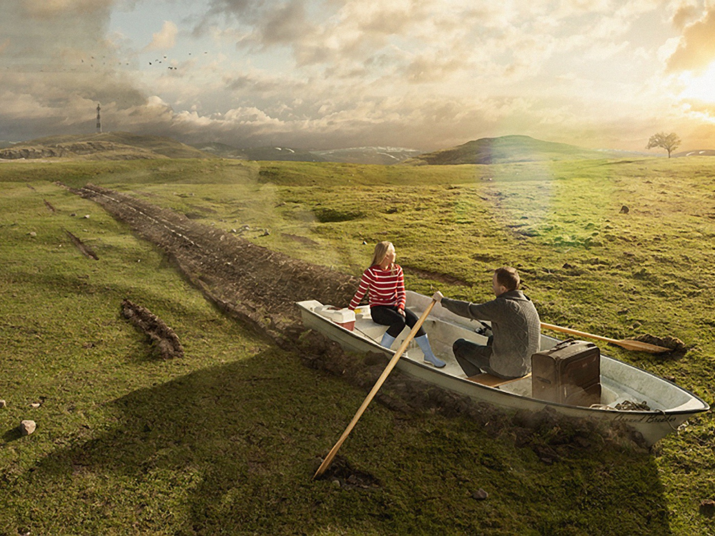 Двое в лодке среди поля