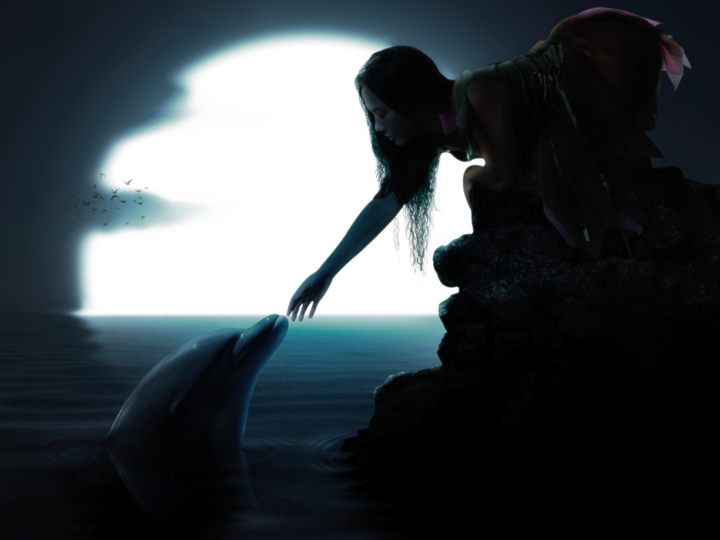 Девушка протянула руку к дельфину