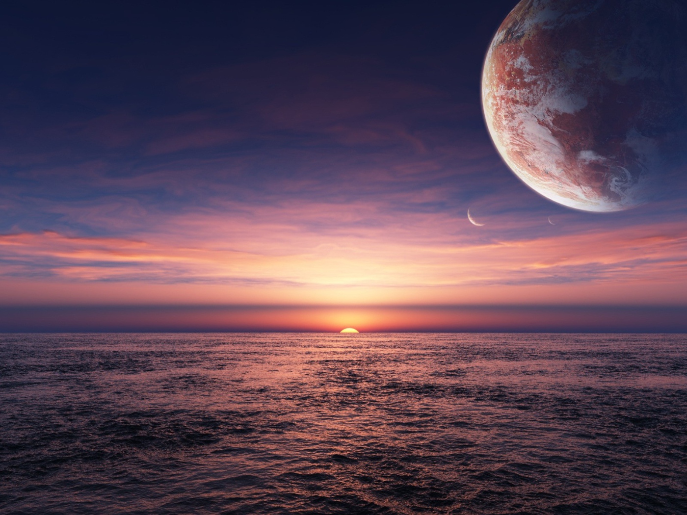 Планета в небе над закатом в океане