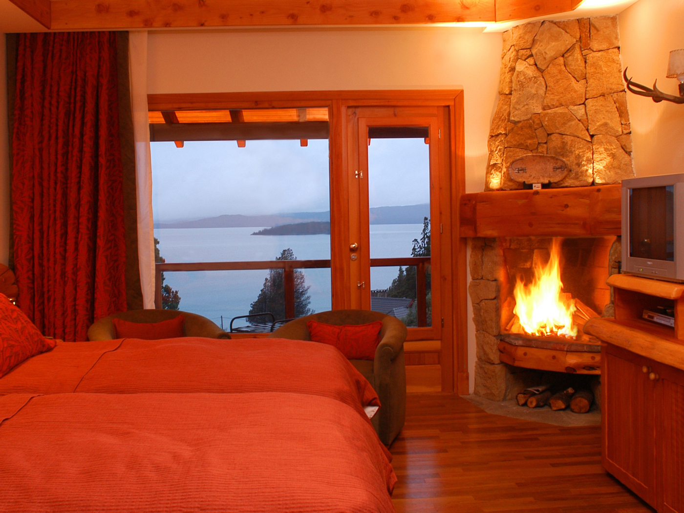 	   Bedroom with a burning fireplace