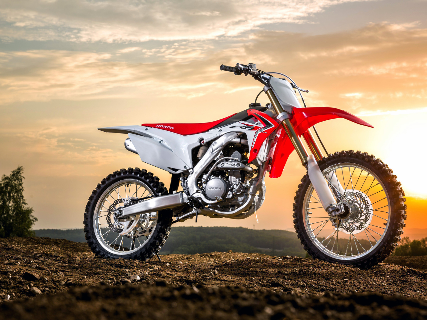 Motorcycle Honda CRF250R on the sunset background