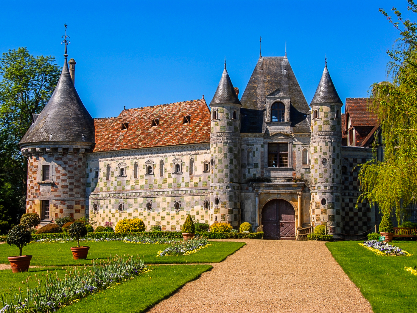 Chateau de St Germain de Livet with green lawn, France