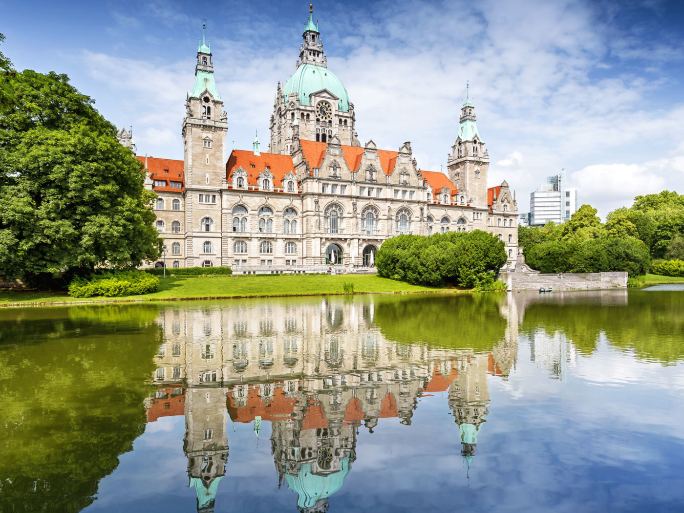 The Town Hall of New Town Hall is reflected in the water, Hannover, Germany