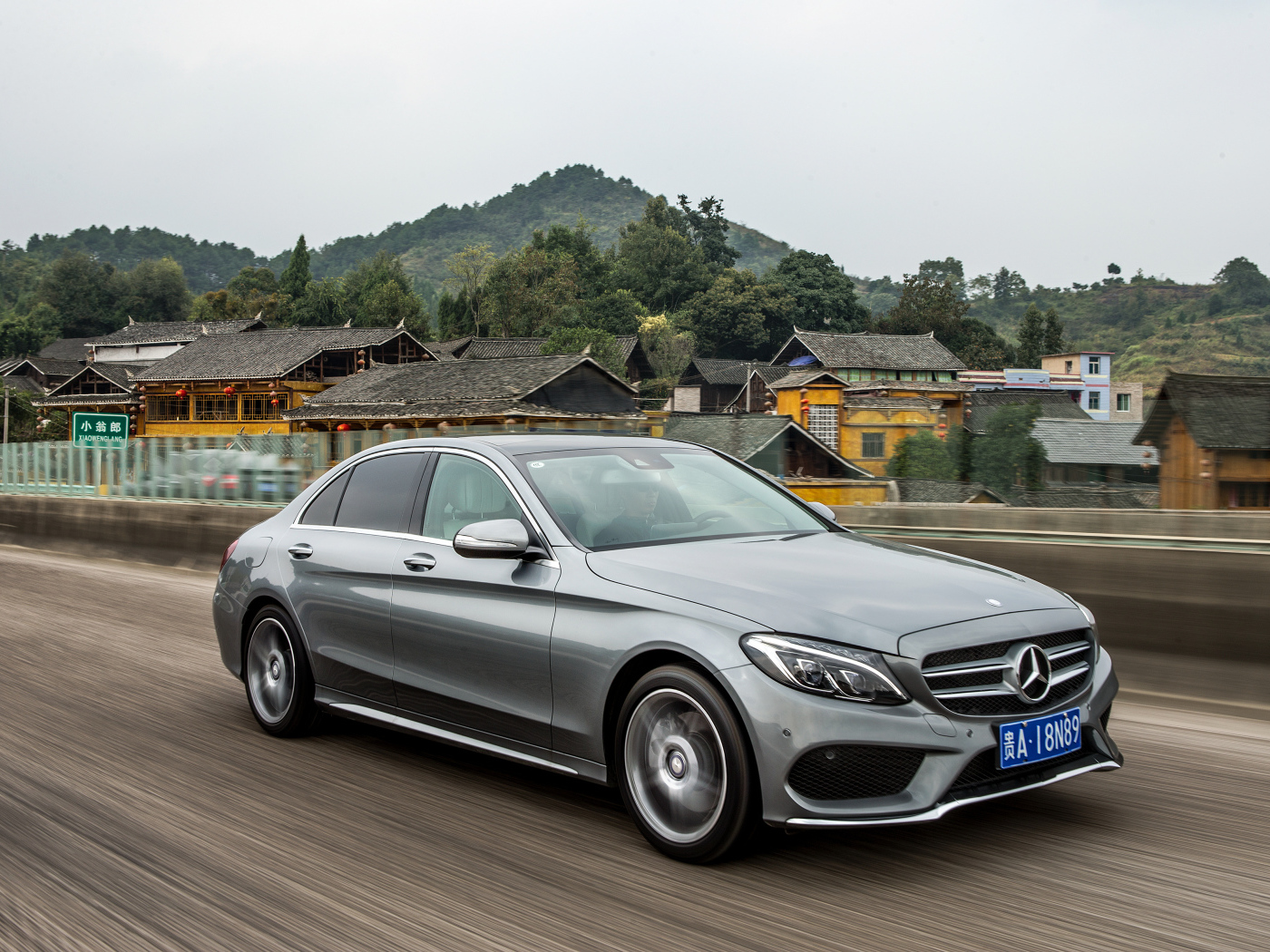 Silver car Mercedes-Benz C-Class on the track