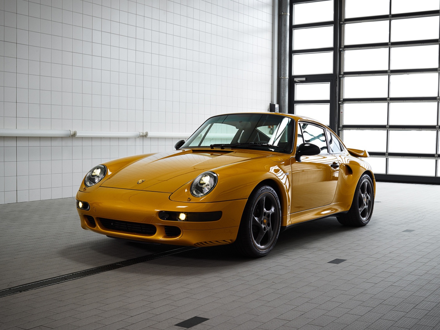 Yellow Porsche 911 Turbo Classic Series, 2018 in the garage