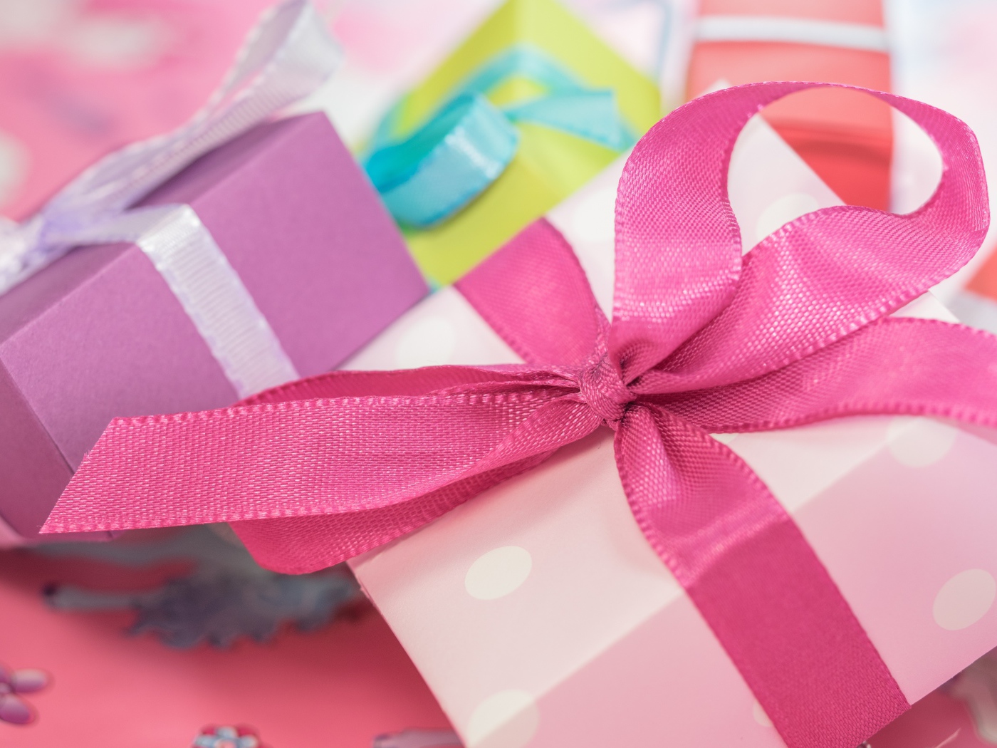 Pink gift with ribbon bow close up