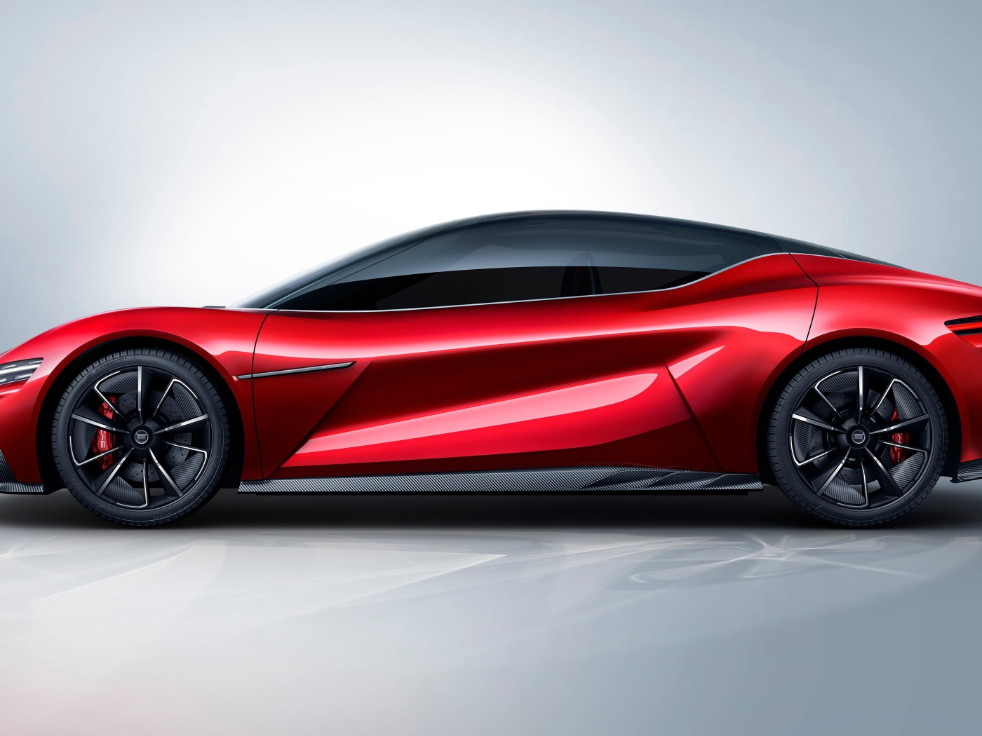 Красный автомобиль BYD E-SEED GT 2019 года на сером фоне