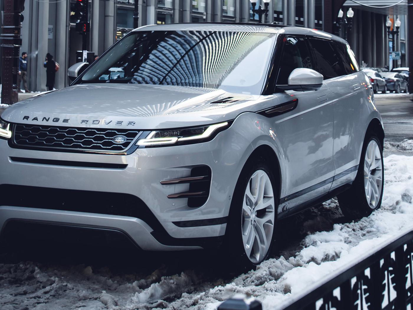 SUV Range Rover Evoque P300 S R-Dynamic 2019 on the snow in the city