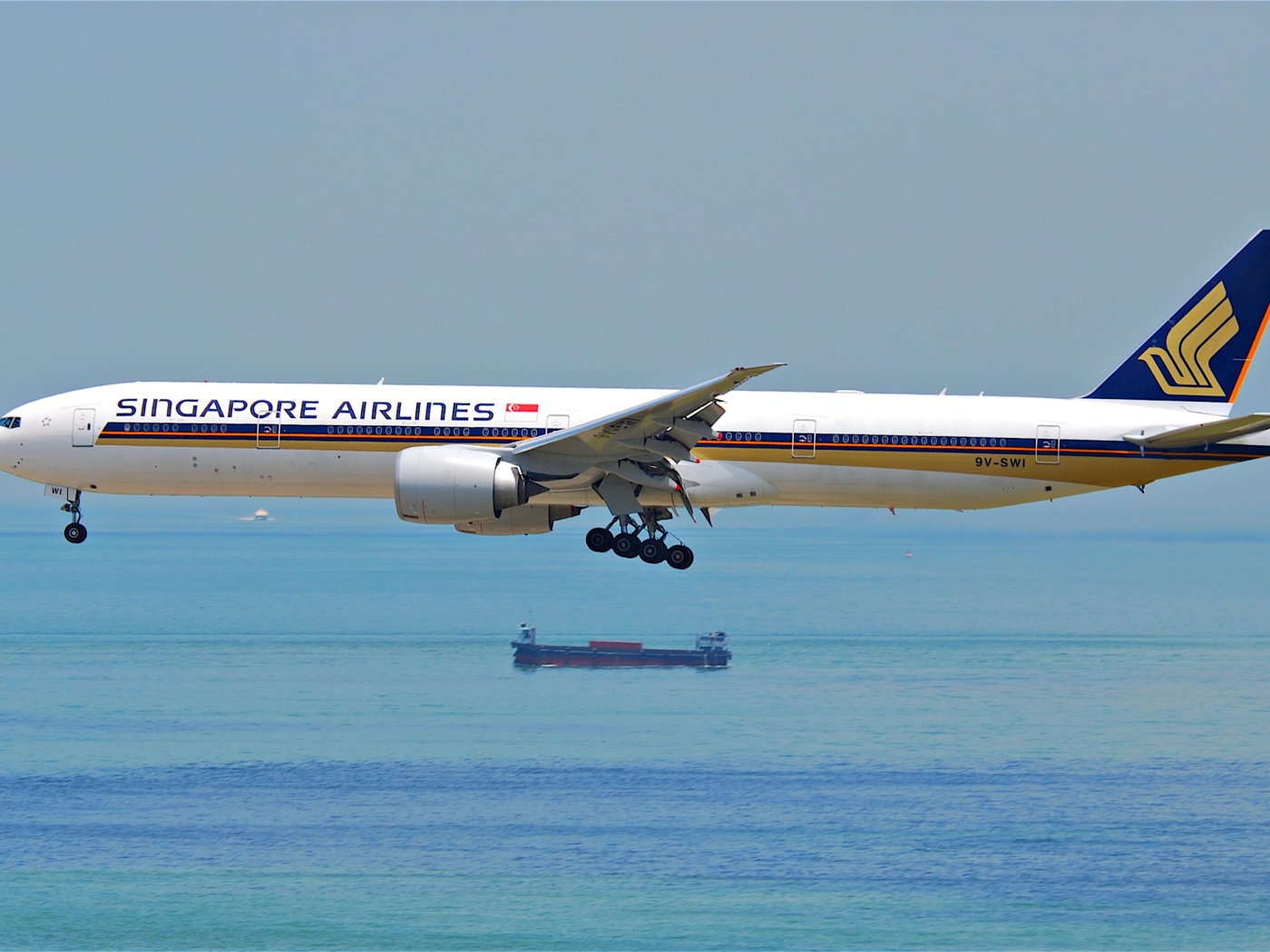 Singapore Airlines Airbus flies over the sea