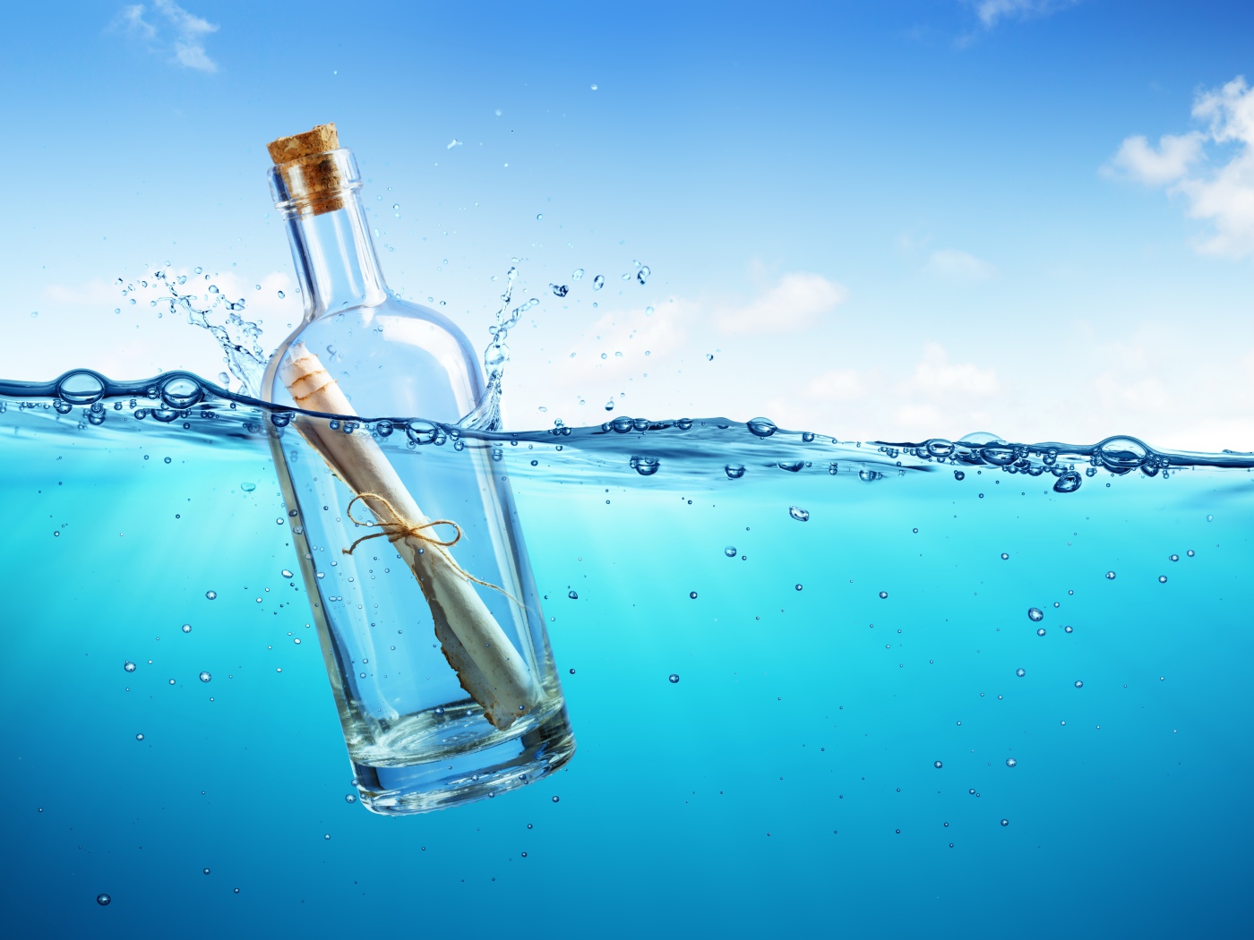 Message bottle floats in the sea