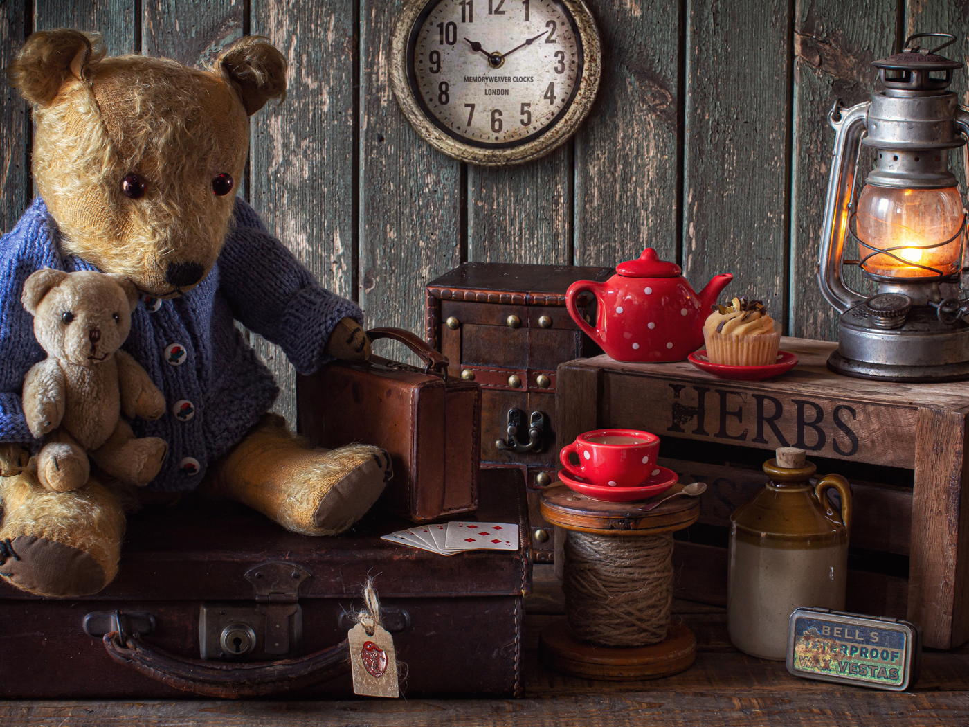 Old teddy bear with toys on the table