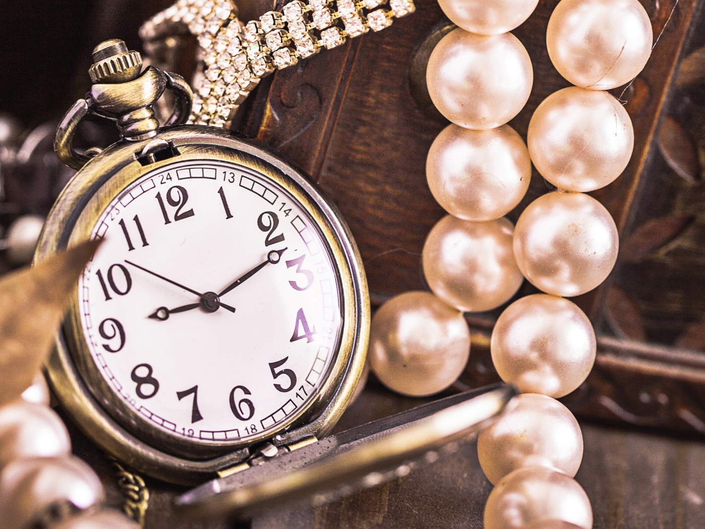 Pocket watch on a chain with pearl beads