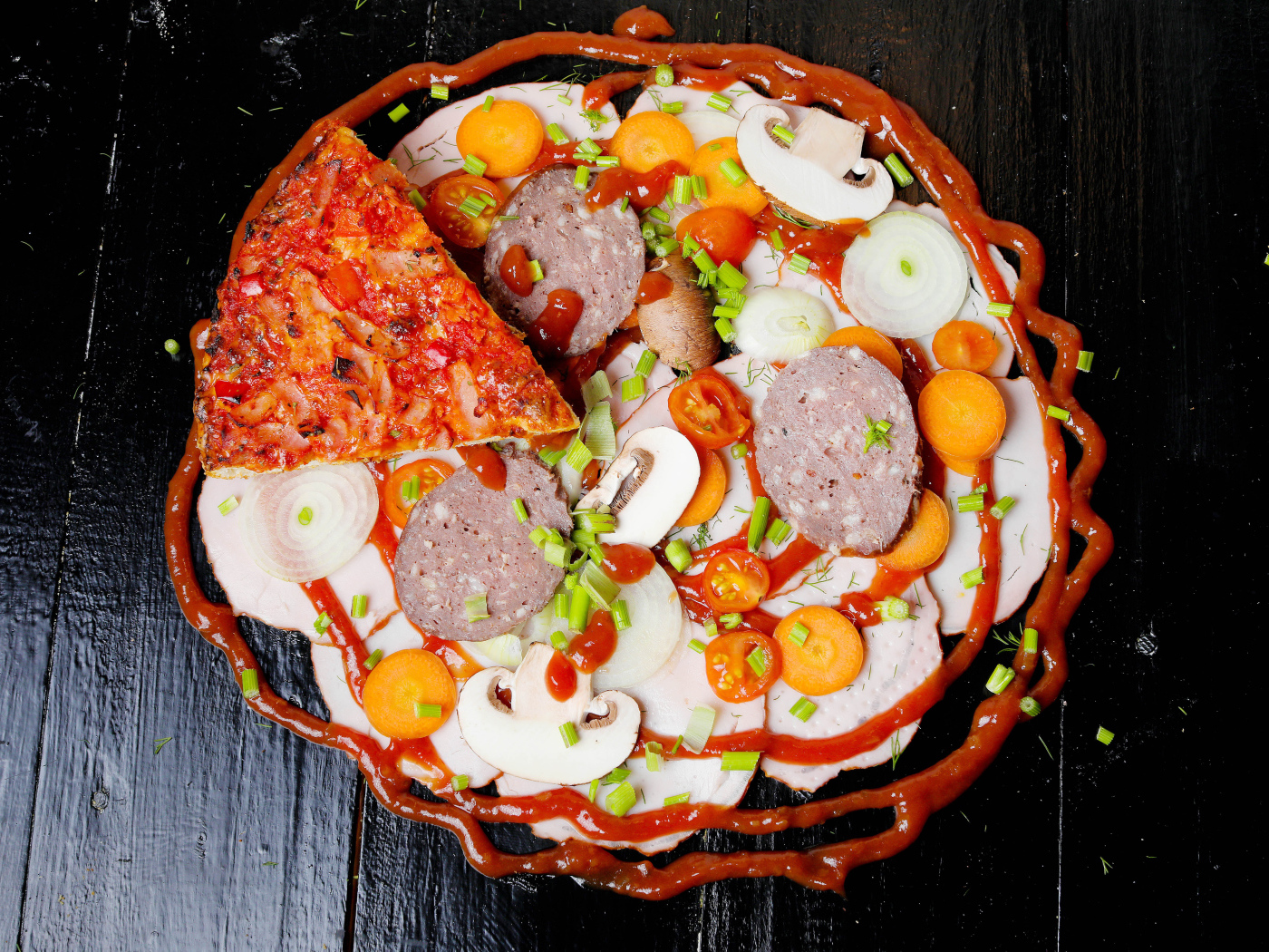 Pizza with vegetables and sausage on a table with ketchup