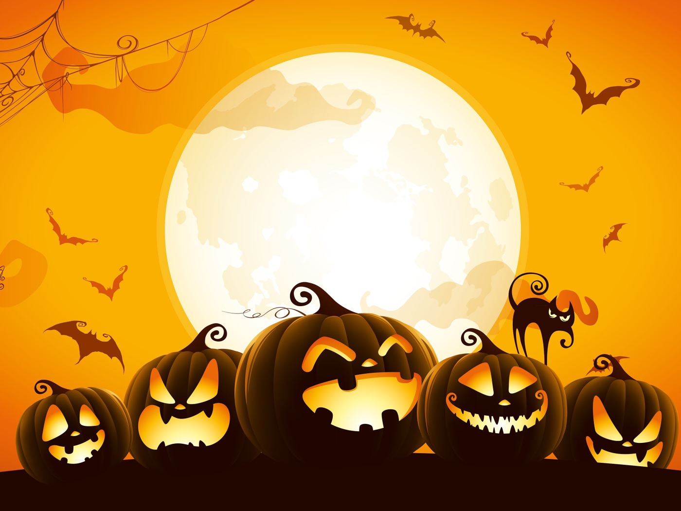 Тыквы на фоне желтой луны на Хэллоуин