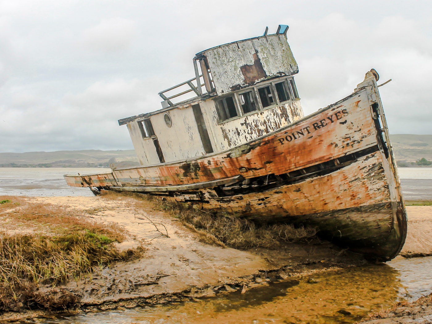 Old abandoned fishing boat on the shore