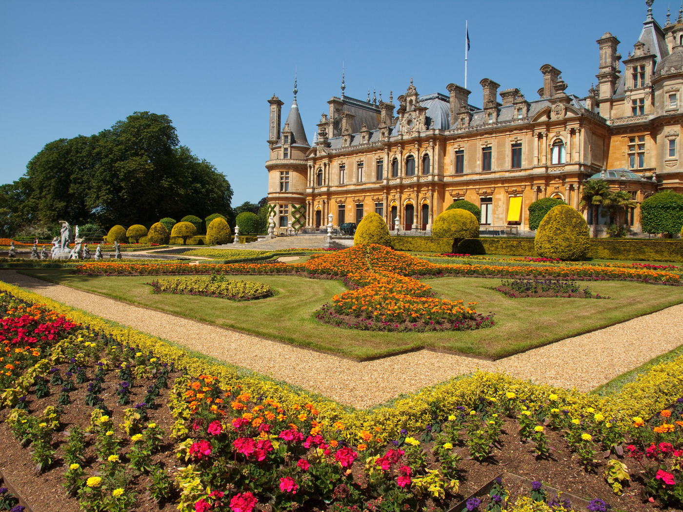 Beautiful Palace Waddesdon Estate with flowers in flower beds