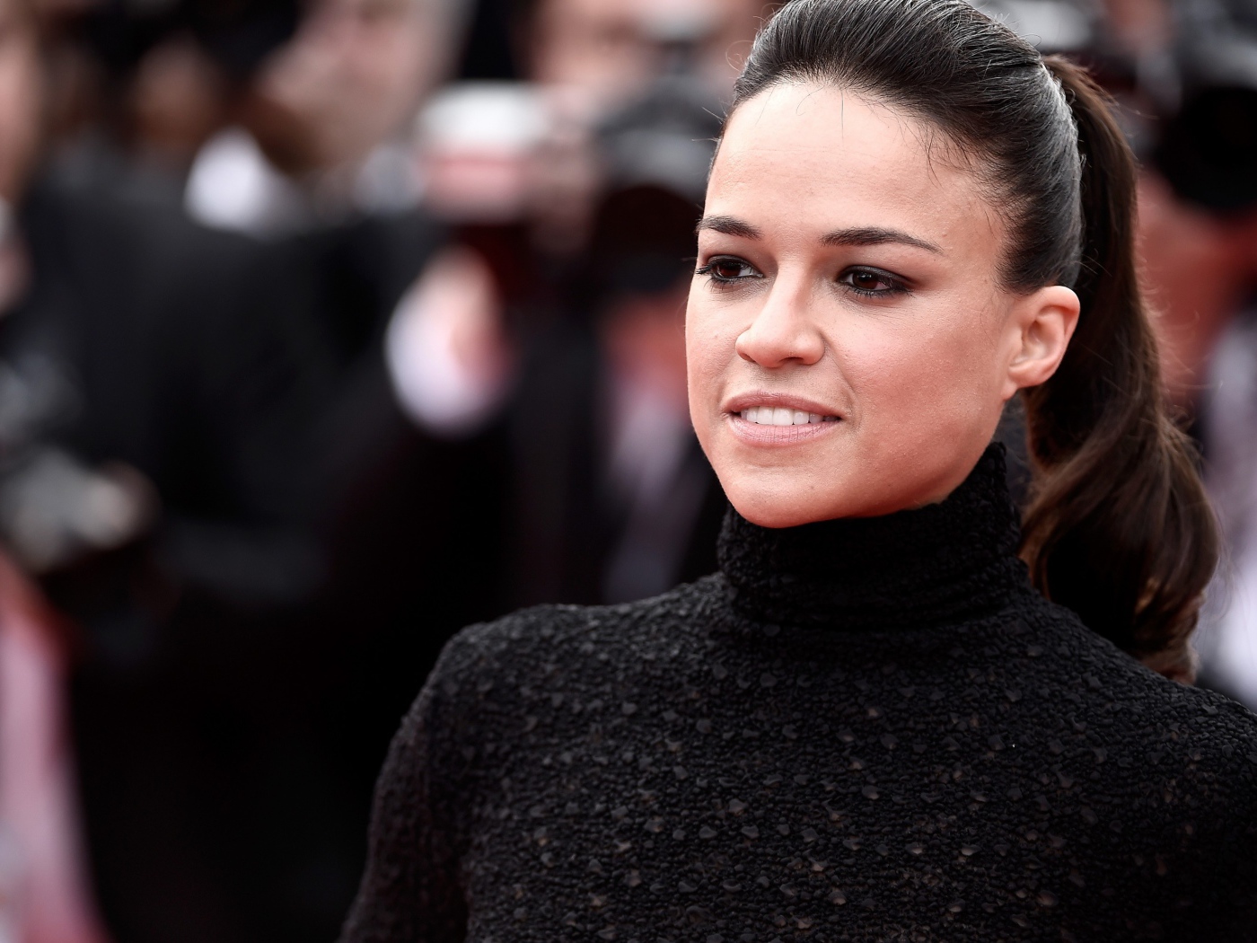 Actress Michelle Rodriguez in a black sweater