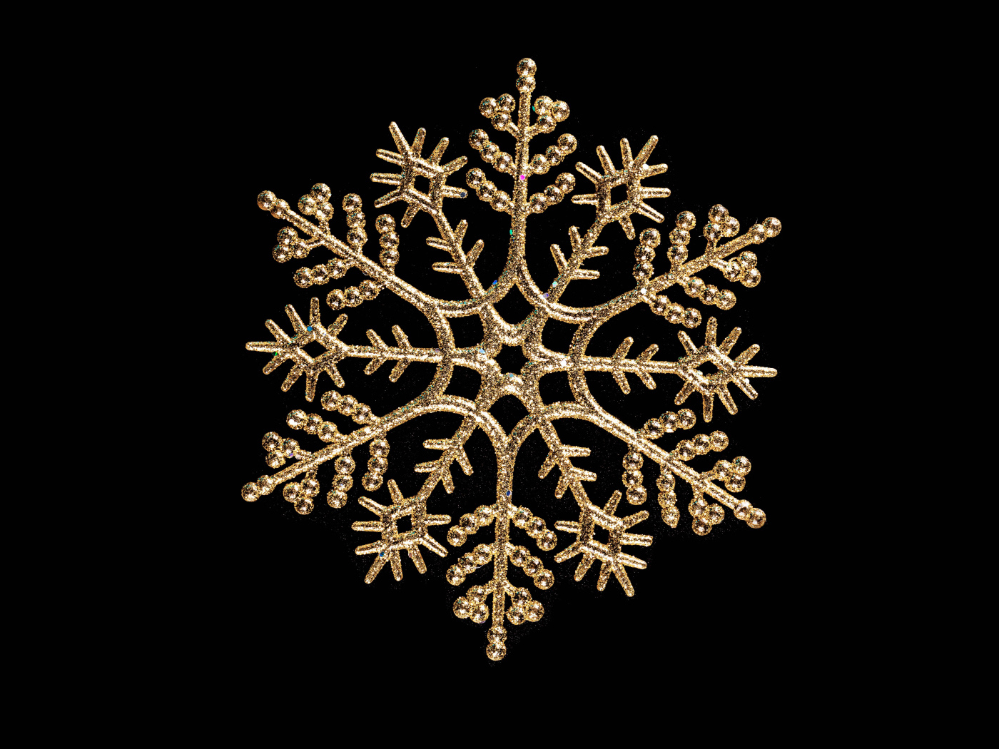 Красивая золотистая снежинка на черном фоне