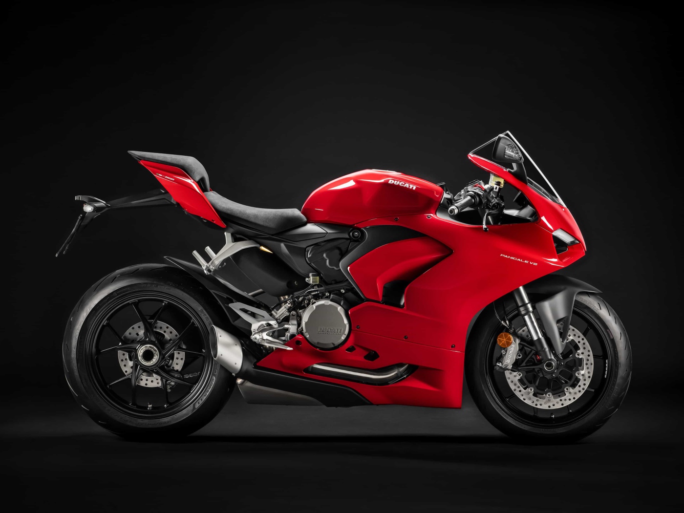 Red motorcycle Ducati Panigale v2, 2020 on a black background