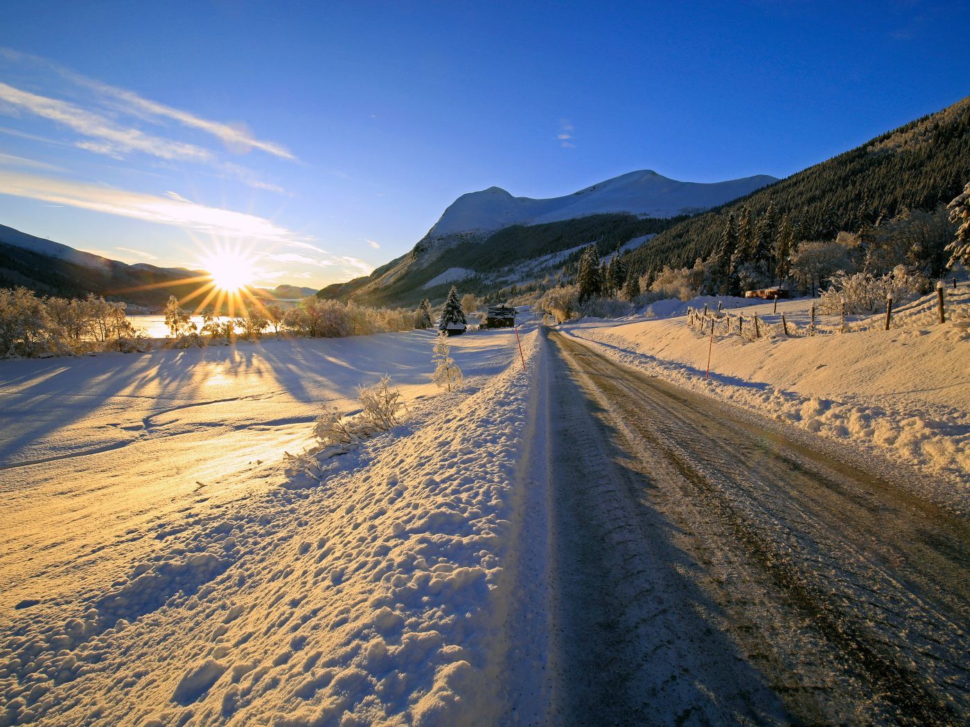 Slippery winter road in the rays of the bright sun