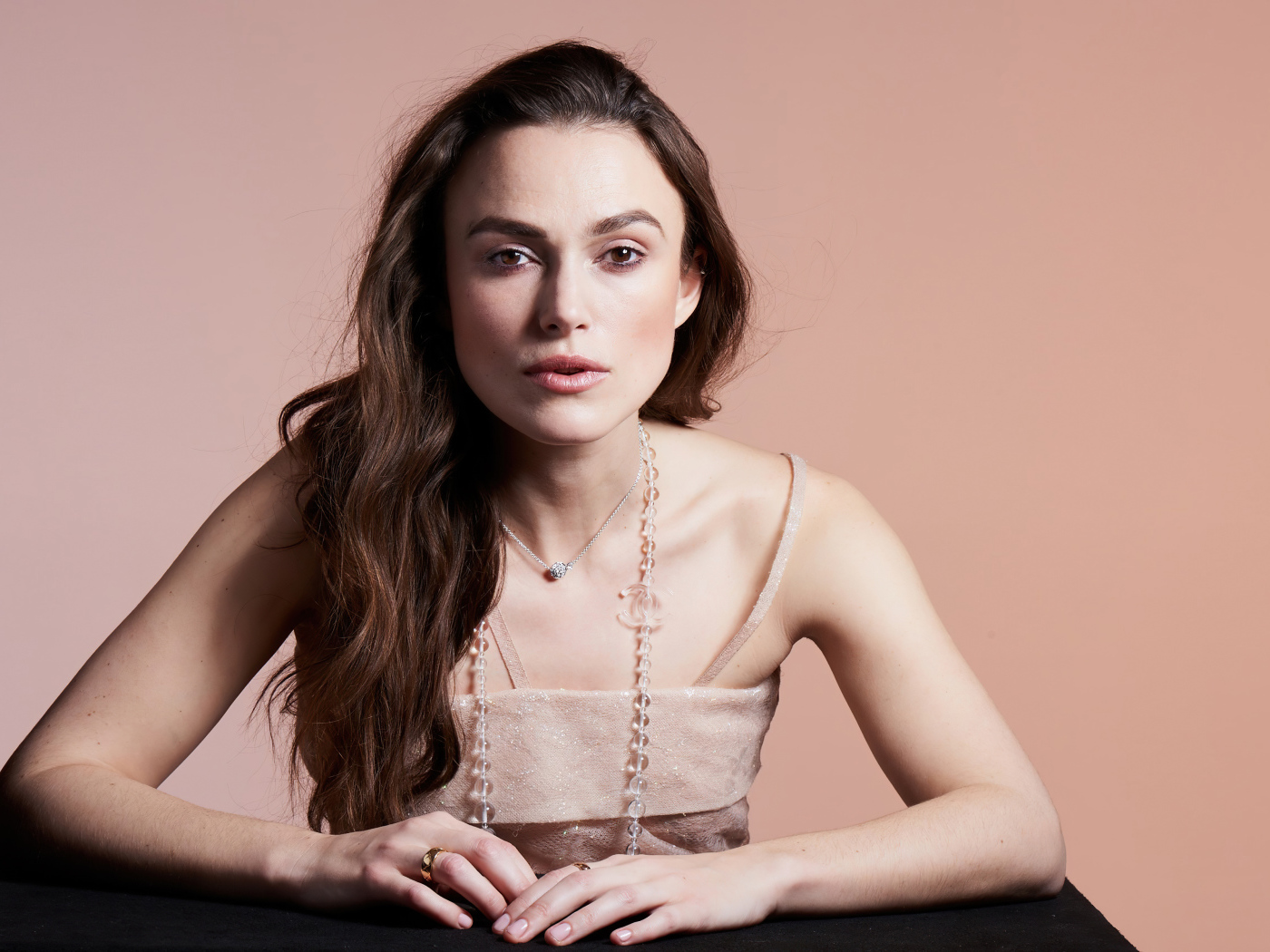 Actress Keira Knightley on a pink background