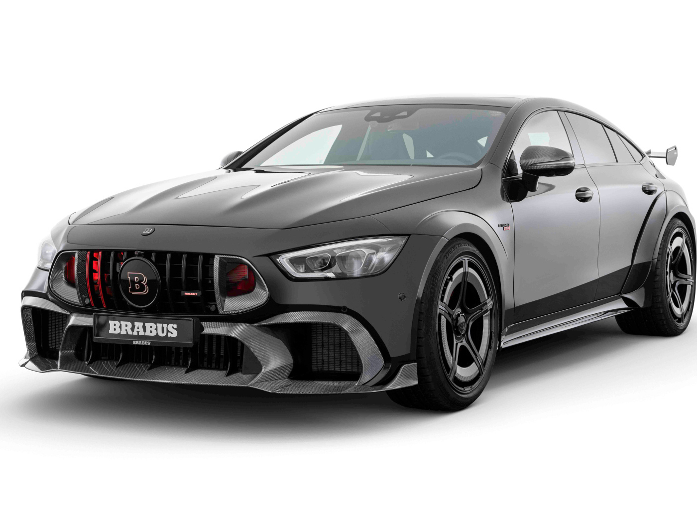 Серый автомобиль Brabus Rocket 1000 2024 года на белом фоне