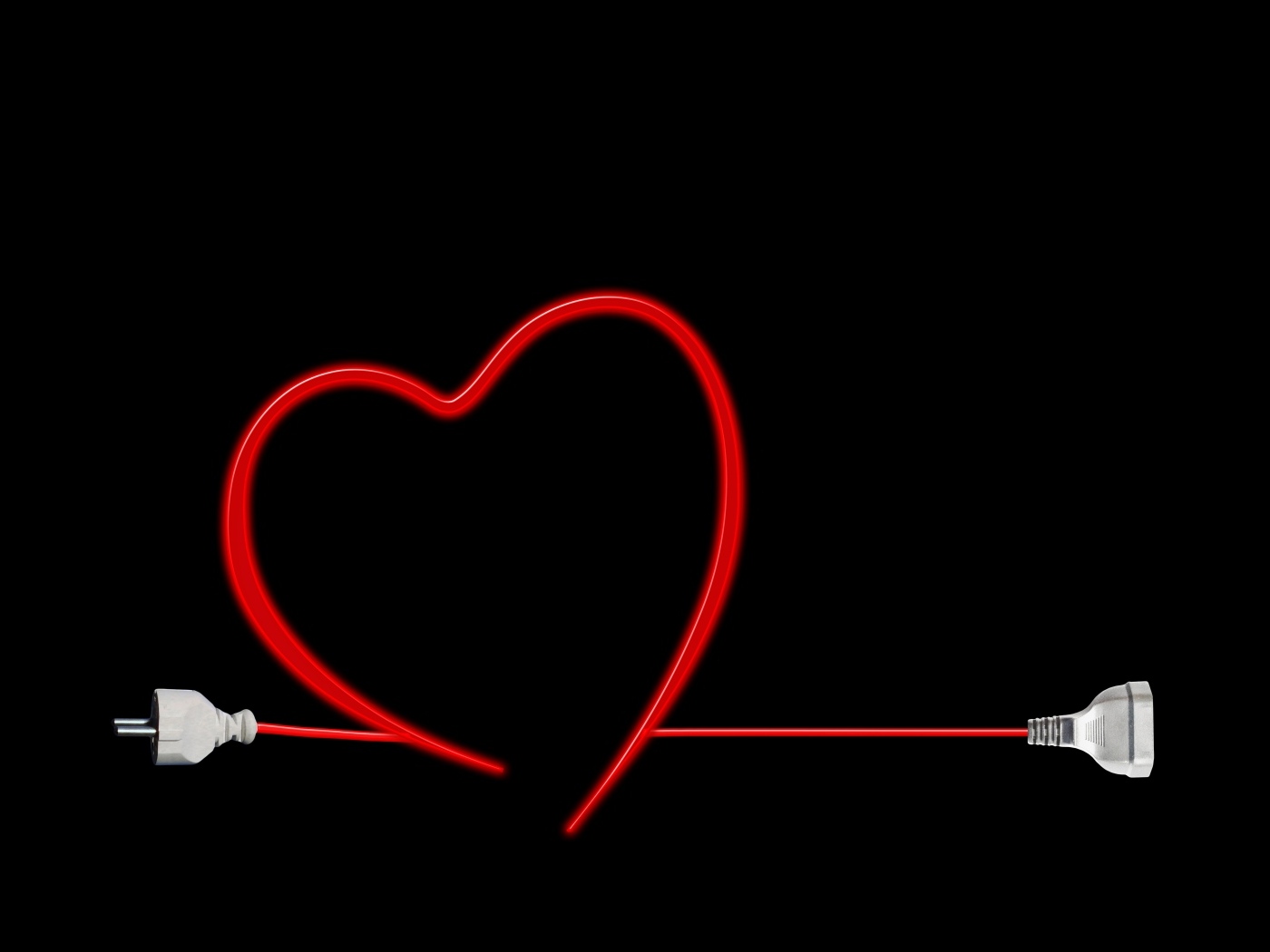Красное сердце из провода на черном фоне