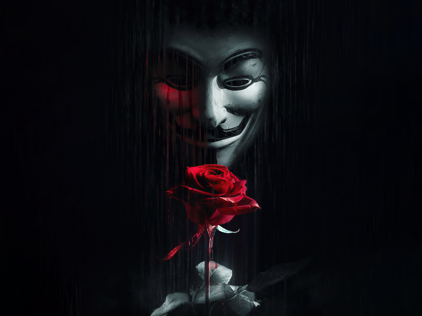 Человек в маске анонимуса с красной розой