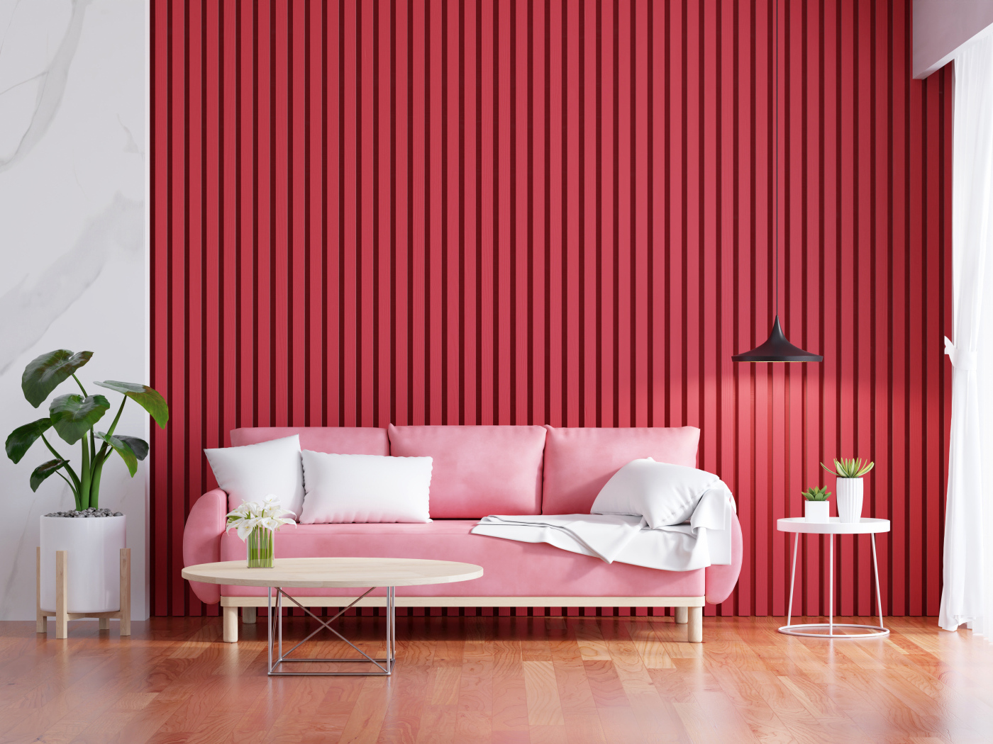 Розовый диван на фоне красной стены
