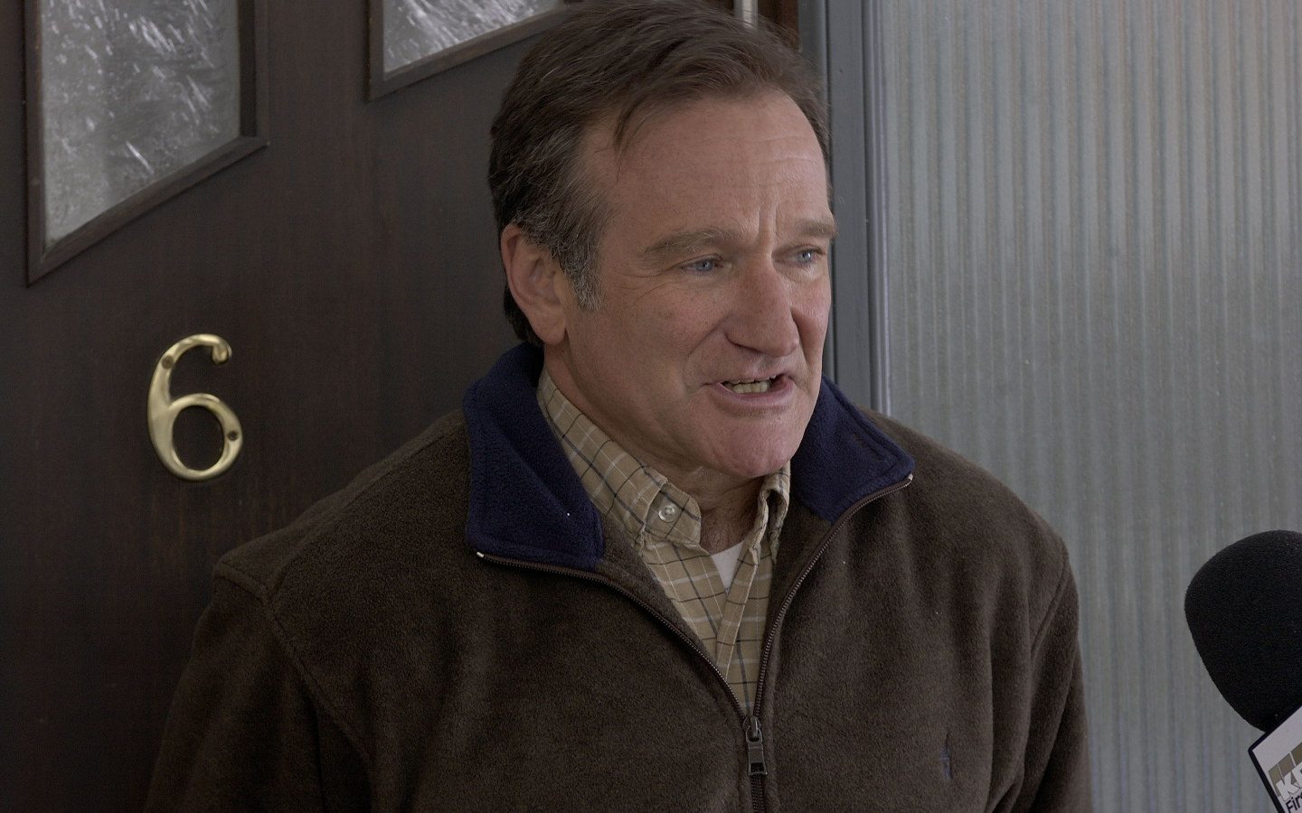 Актер Робин Уильямс у двери