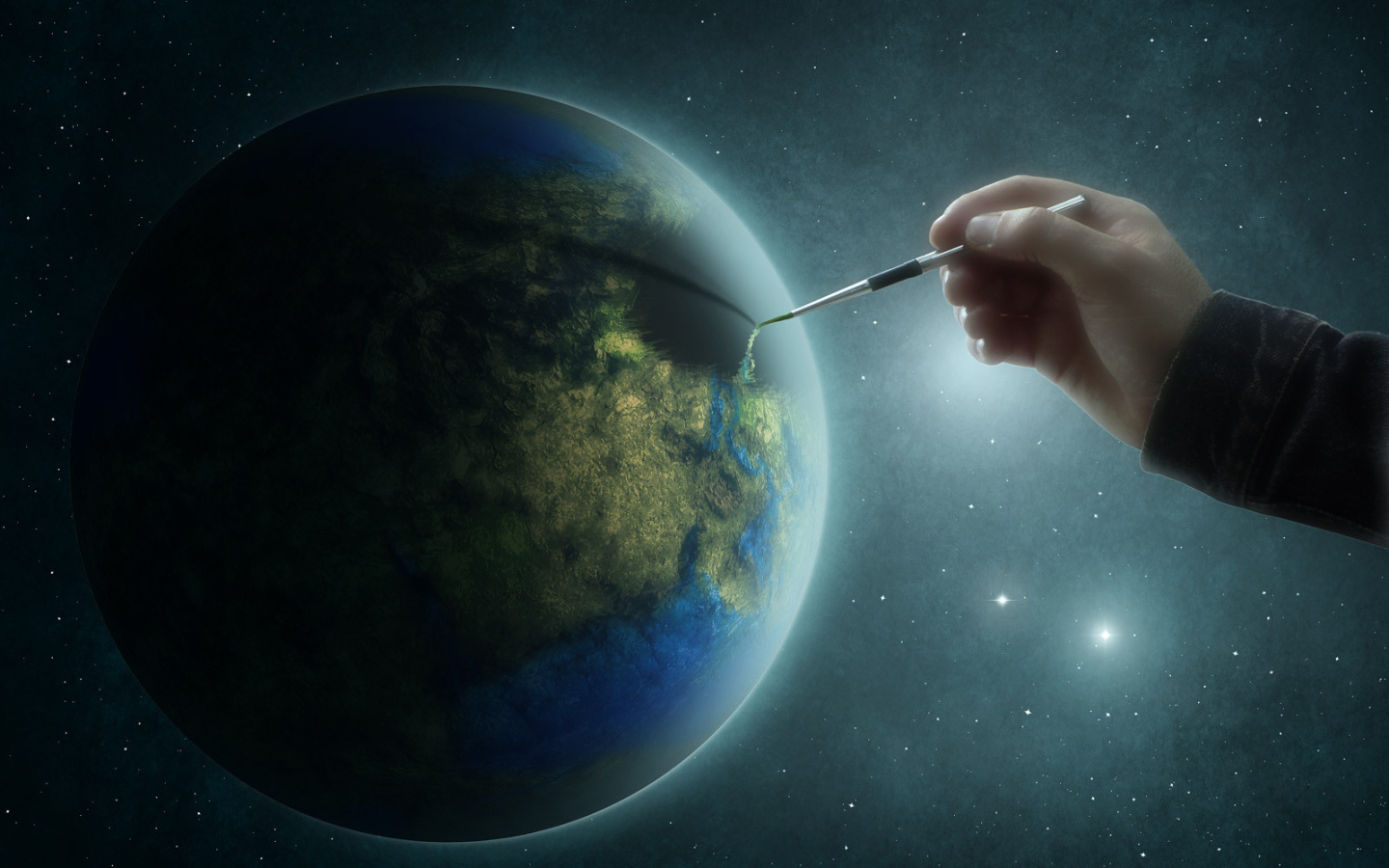 Рука рисует на планете