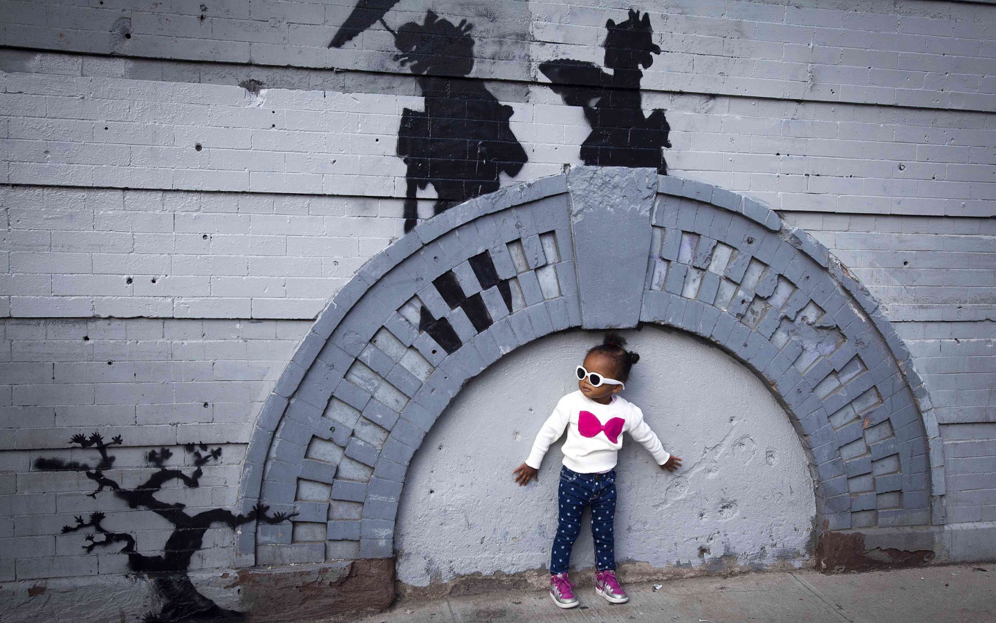 Little girl near graffiti