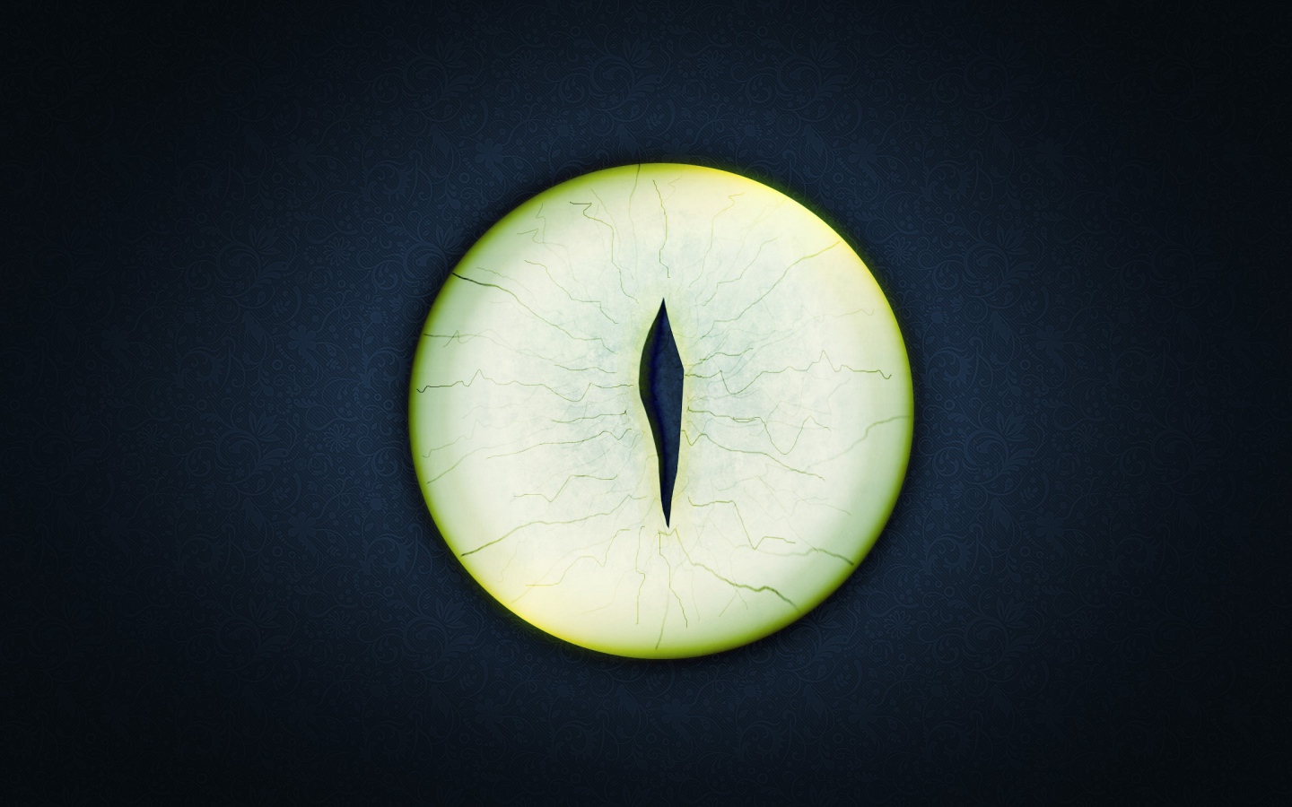 Круглый зеленый глаз на черном фоне