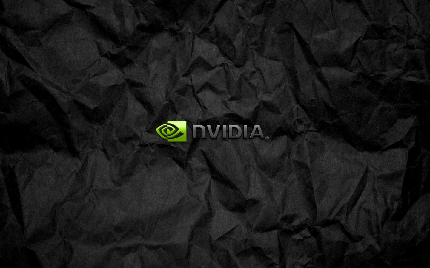 Символика Nvidia на мятой черной бумаге