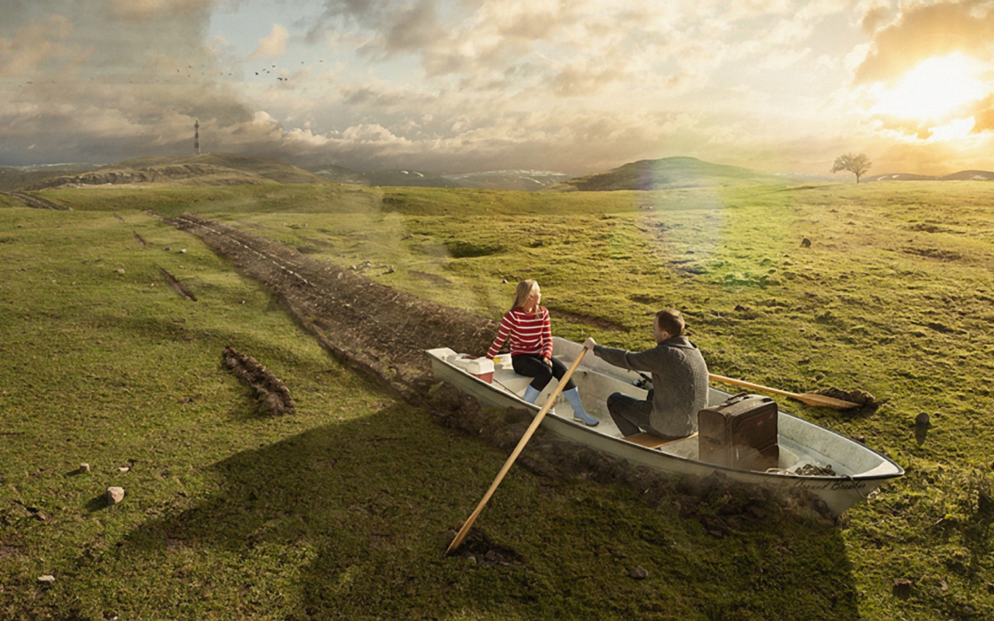 Двое в лодке среди поля