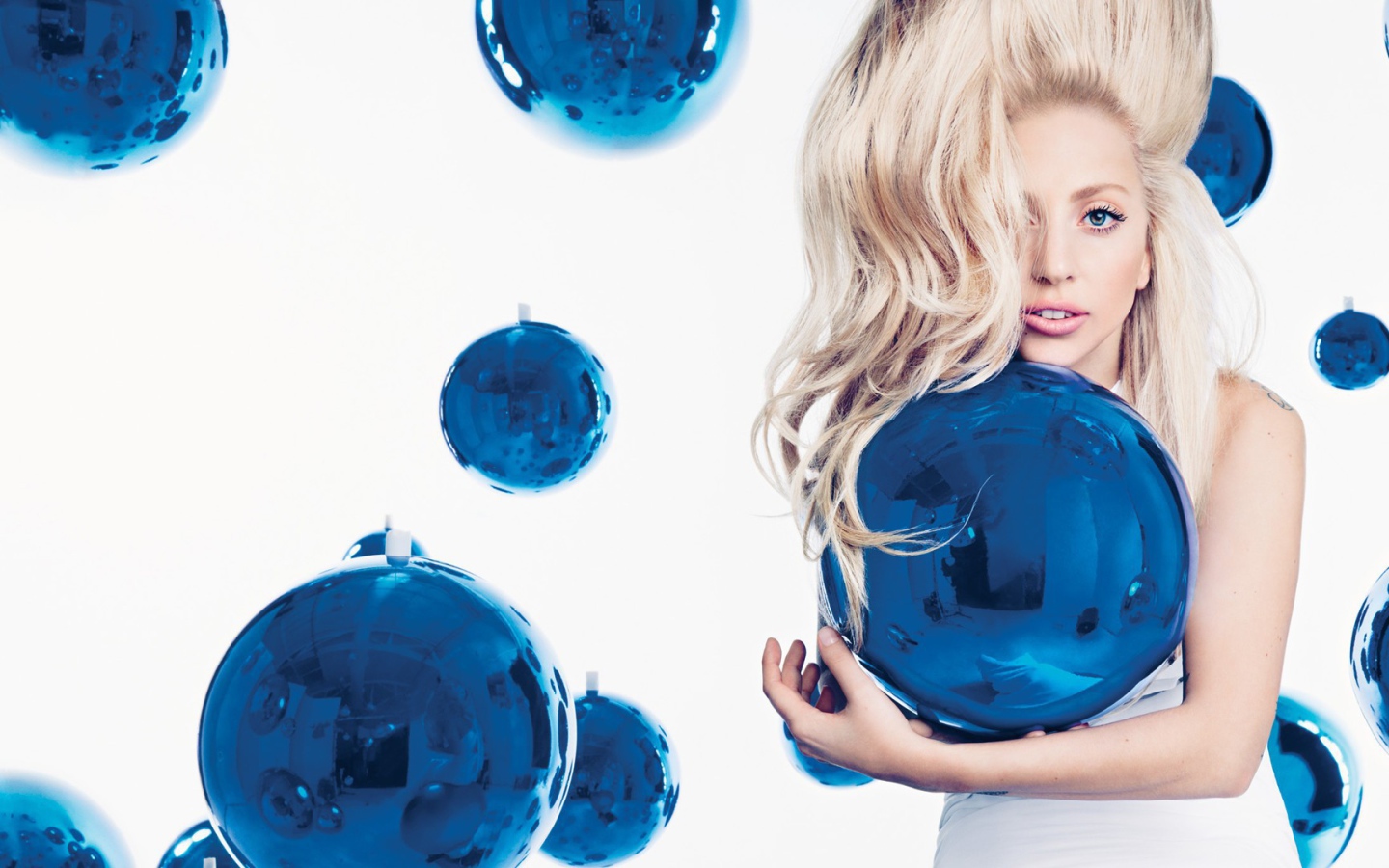 Girl among blue balls