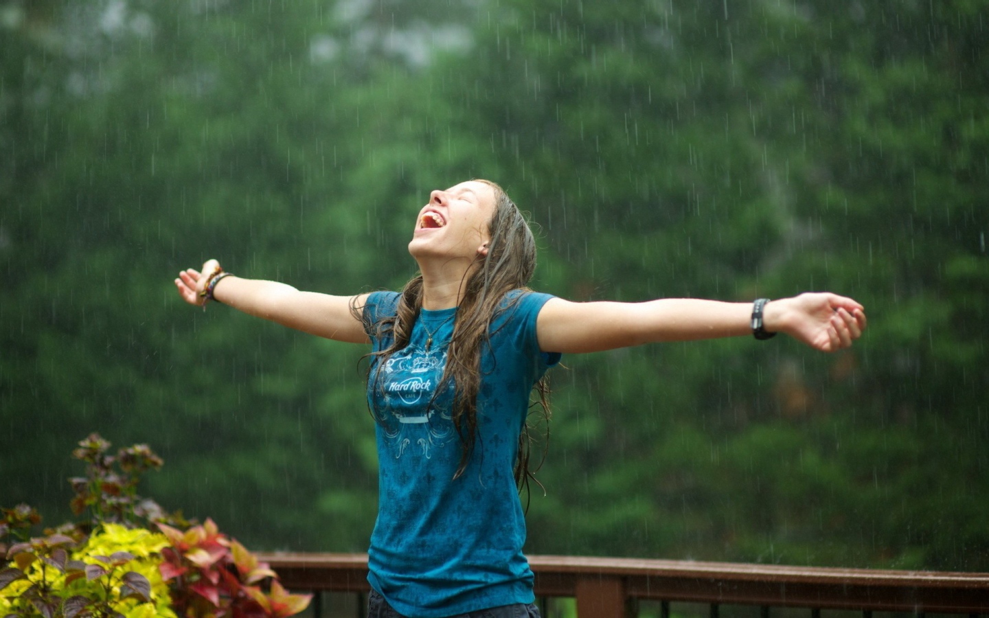 Girl enjoys summer rain
