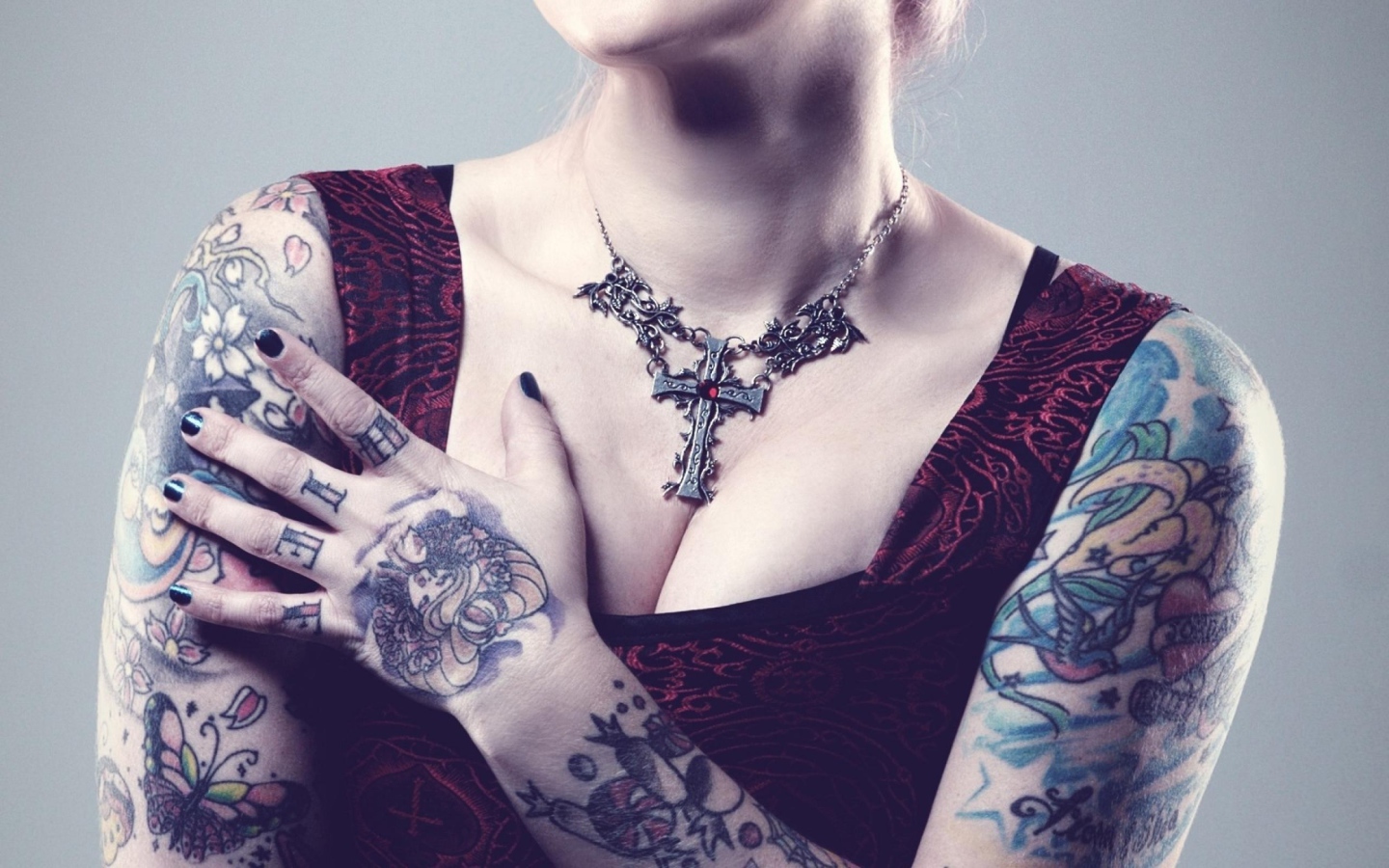 Beautiful pendant on his chest tattooed girl