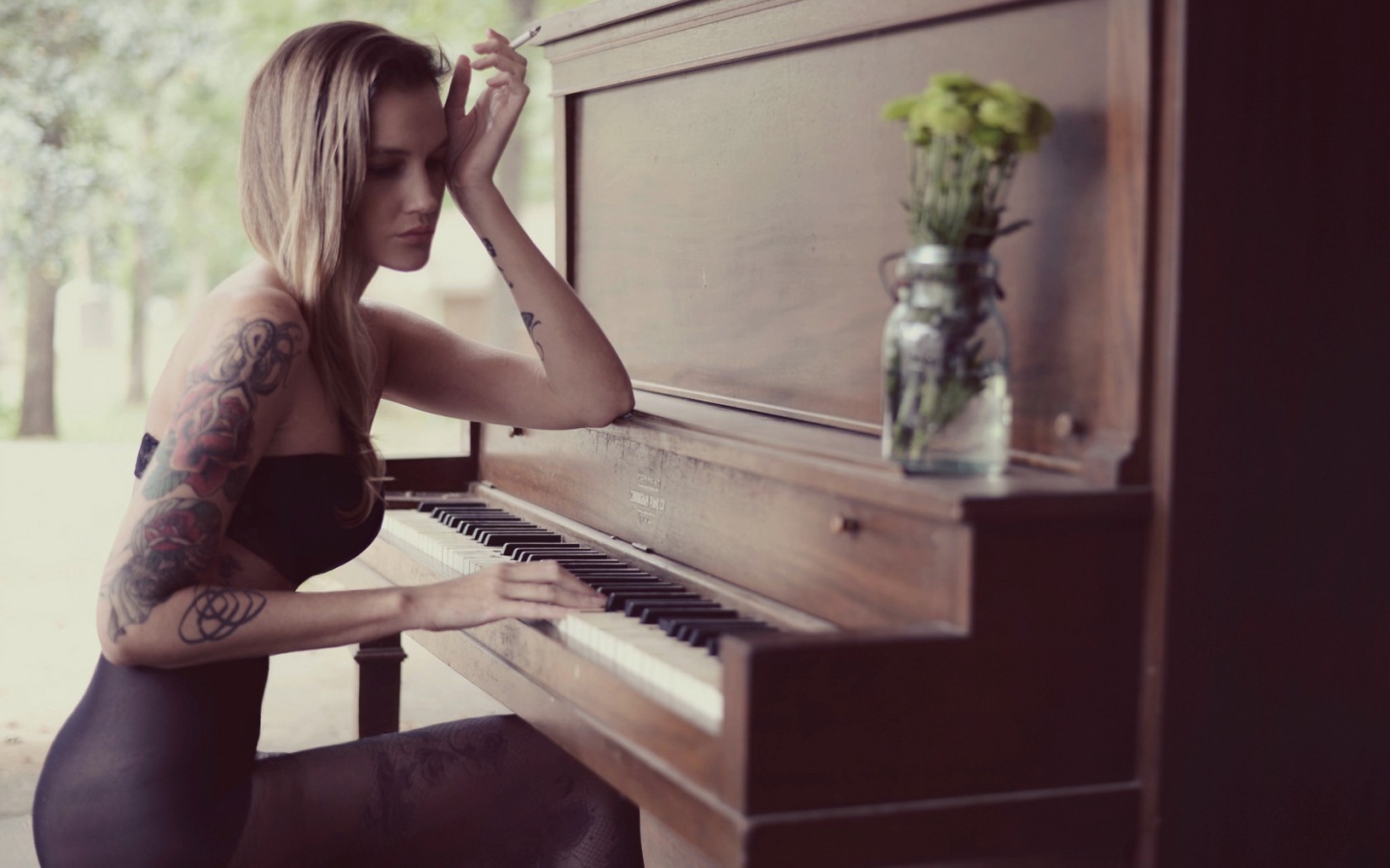 Girl with tattoo playing the piano Desktop wallpapers 1440x900