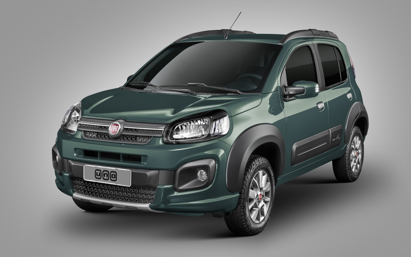 Зеленый автомобиль Fiat Uno Way на сером фоне