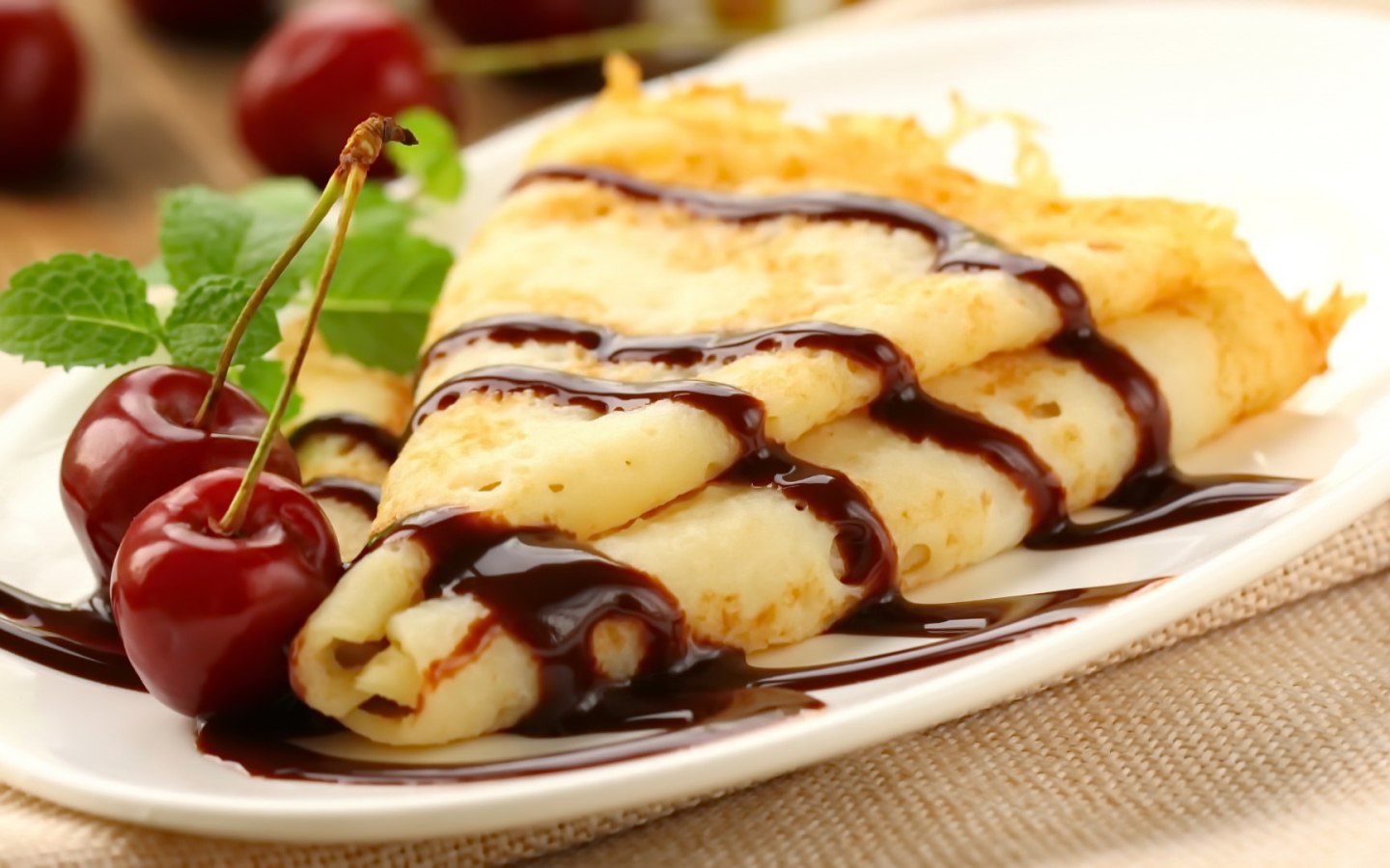 Fine pancakes with chocolate and cherries on Shrove Tuesday