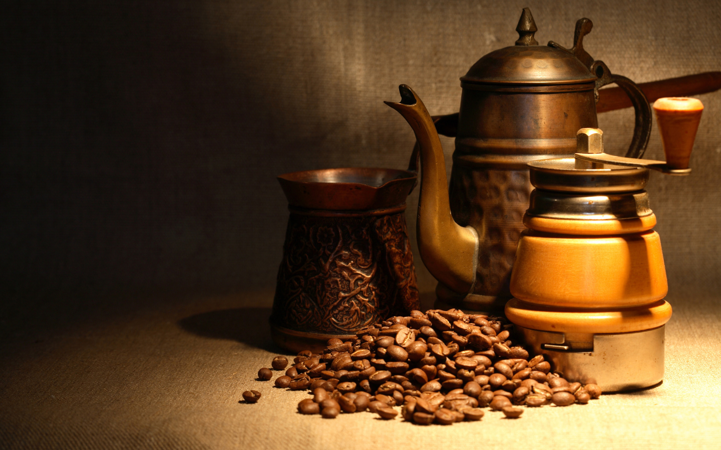 Coffee grinder, Turk, kettle and coffee beans on the table