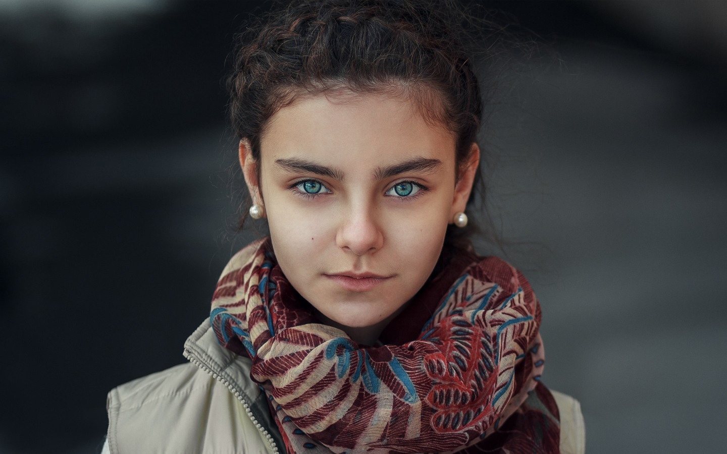 Beautiful girl with a scarf around her neck
