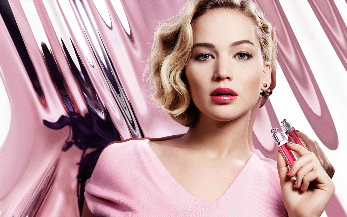 Popular actress Jennifer Lawrence with lip gloss in her hands