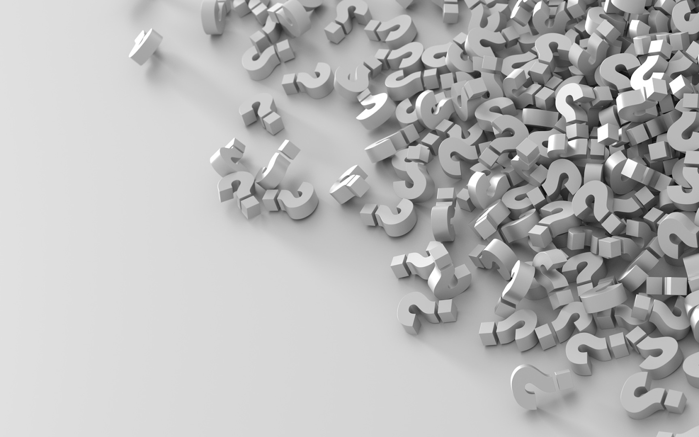 Много знаков вопроса на серой поверхности 