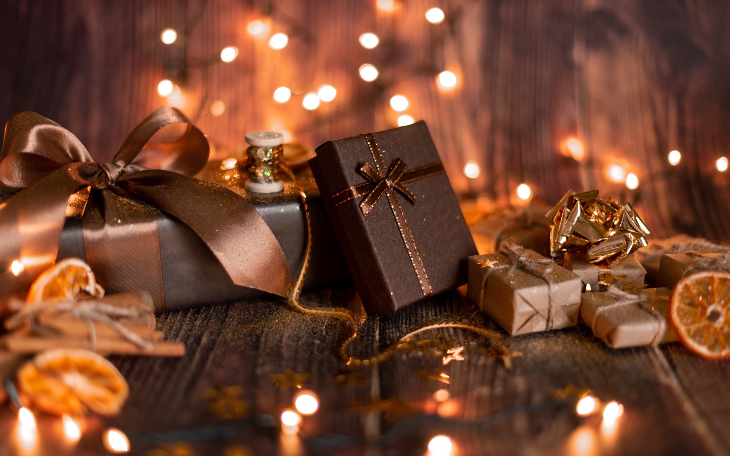 A lot of gifts on a wooden background with a garland