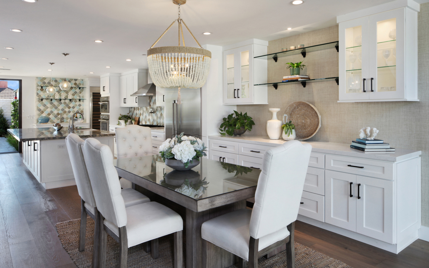 Kitchen with dining area with white furniture