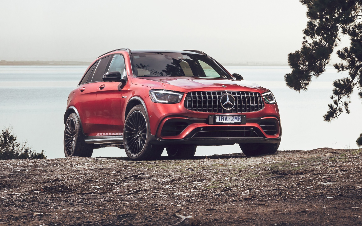 Red Mercedes-AMG GLC 63 S 4MATIC 2020 car near the water