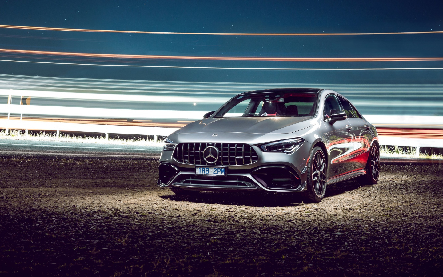 Серебристый автомобиль Mercedes-AMG CLA 45 S 4MATIC, 2020 года у трассы 