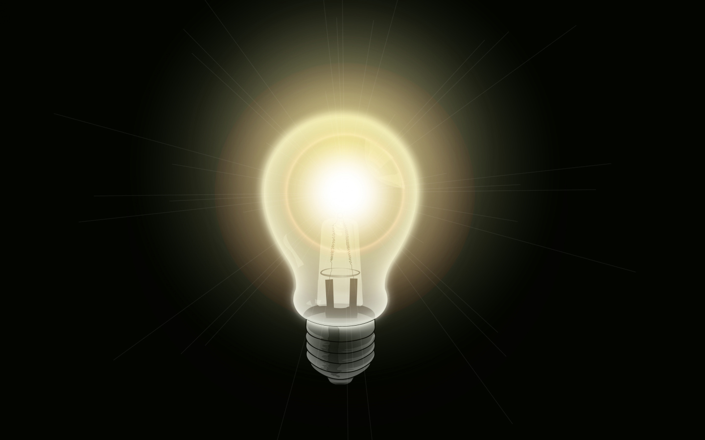 Зажженная лампа накаливания на черном фоне